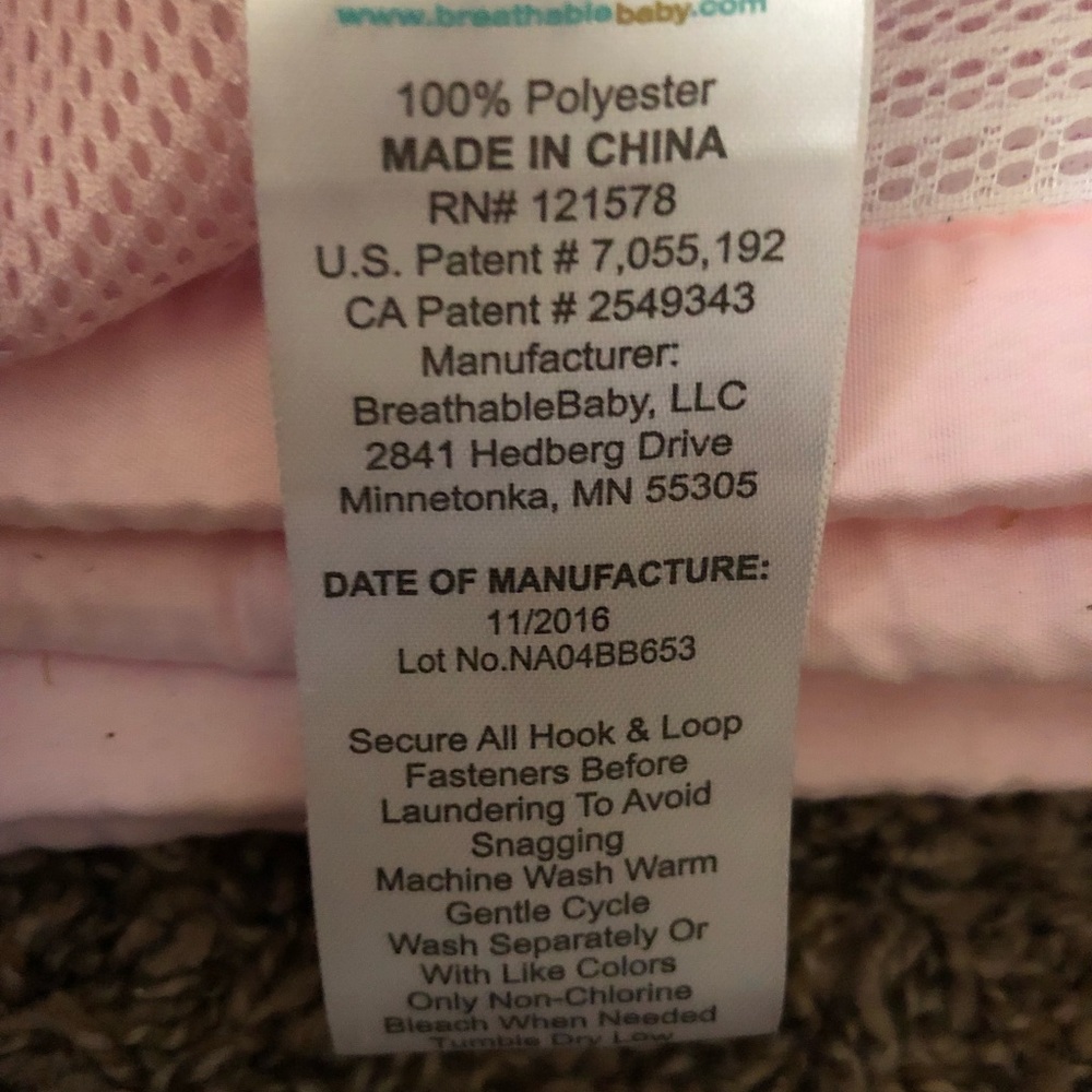 Pink and white crib liner
